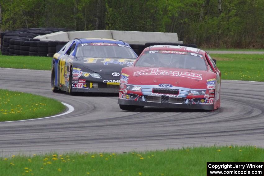 Dale Quarterley's Ford Fusion and Giles Thornton's Toyota Camry