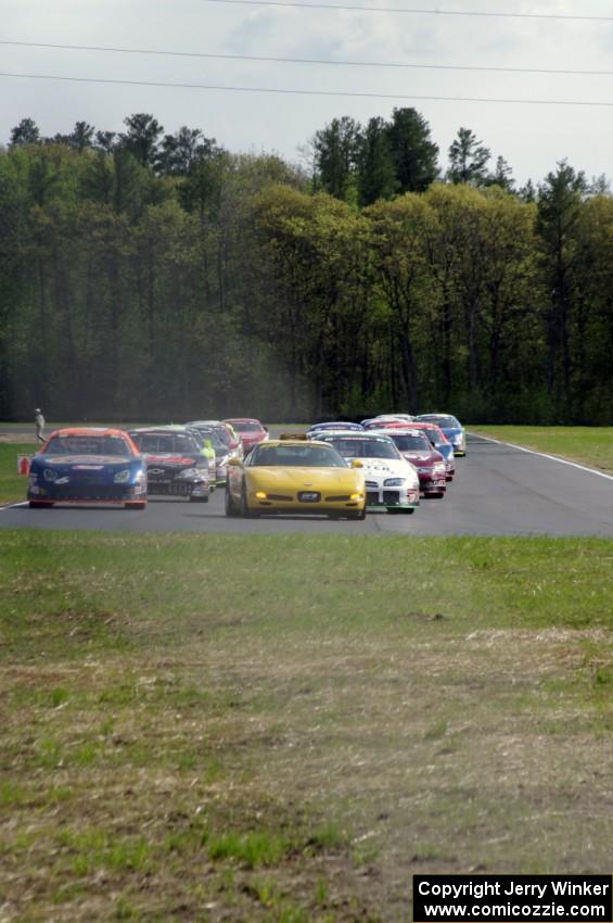The field behind the pace car on the pace lap.