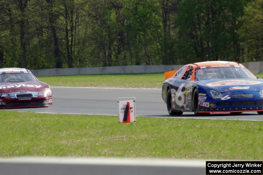 Derek Thorn's Ford Fusion ahead of Cameron Hayley's Ford Fusion
