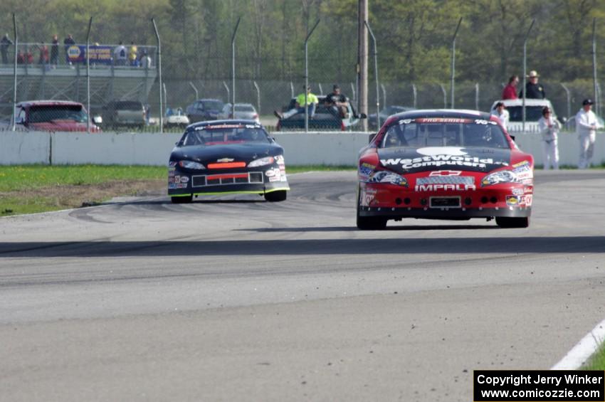 Carl Harr's Chevy Impala ahead of Dylan Hutchison's Chevy Impala