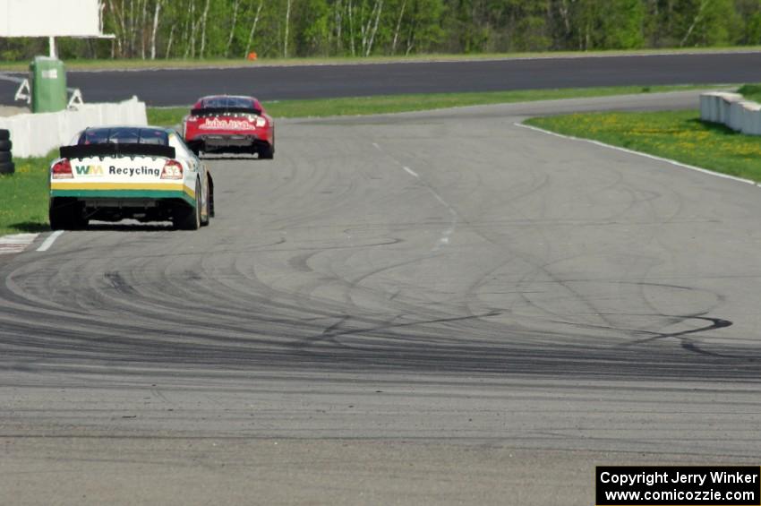 Andrew Ranger's Dodge Charger chases Dale Quarterley's Ford Fusion out of turn 13.