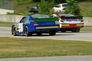 Jason Bowles's Toyota Camry passes Kyle Kelley's Chevy Impala before the kink