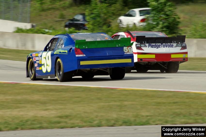 Jason Bowles's Toyota Camry passes Kyle Kelley's Chevy Impala before the kink