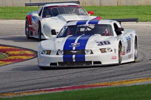 Cliff Ebben's Ford Mustang and Simon Gregg's Chevy Corvette