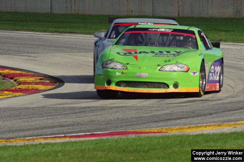 Bill Prietzel's Chevy Monte Carlo and A.J. Henriksen's Chevy Camaro