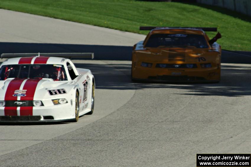 Denny Lamers's Ford Mustang and David Jans's Ford Mustang on the cool-off lap