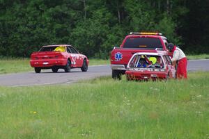 Team Party Cat Honda Civic gets picked up in turn 5 as the Looney Tunes Honda Prelude passes.