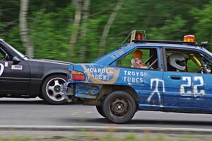 Cockroach Racing Ford Escort passes the Twisted Ford Mustang in turn 3.