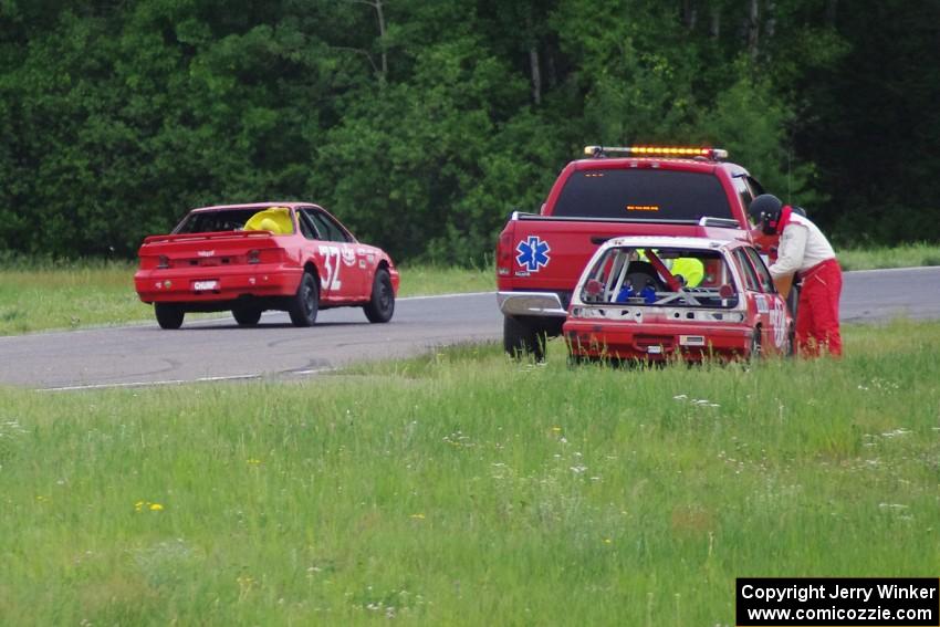 Team Party Cat Honda Civic gets picked up in turn 5 as the Looney Tunes Honda Prelude passes.