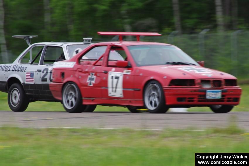 Flying Circus BMW E36 passes the North Star Chump Car - NSCC BMW 318i into turn 3.