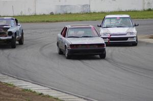 Bare Metal Racing Nissan Sentra and Slugworks Racing Honda Civic pass the Dutch Rudder Racing Datsun 280Z