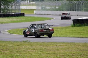 Bare Metal Racing Nissan Sentra and E30 Bombers BMW 325i exiting the carousel.