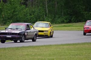 Speedlab BMW 325e and Team Short Bus VW Golf pass the Looney Tunes Honda Prelude