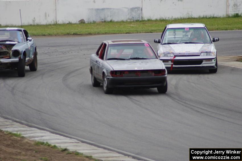 Bare Metal Racing Nissan Sentra and Slugworks Racing Honda Civic pass the Dutch Rudder Racing Datsun 280Z