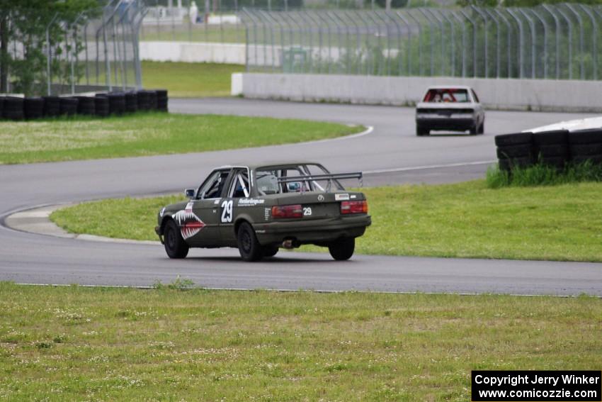 Bare Metal Racing Nissan Sentra and E30 Bombers BMW 325i exiting the carousel.