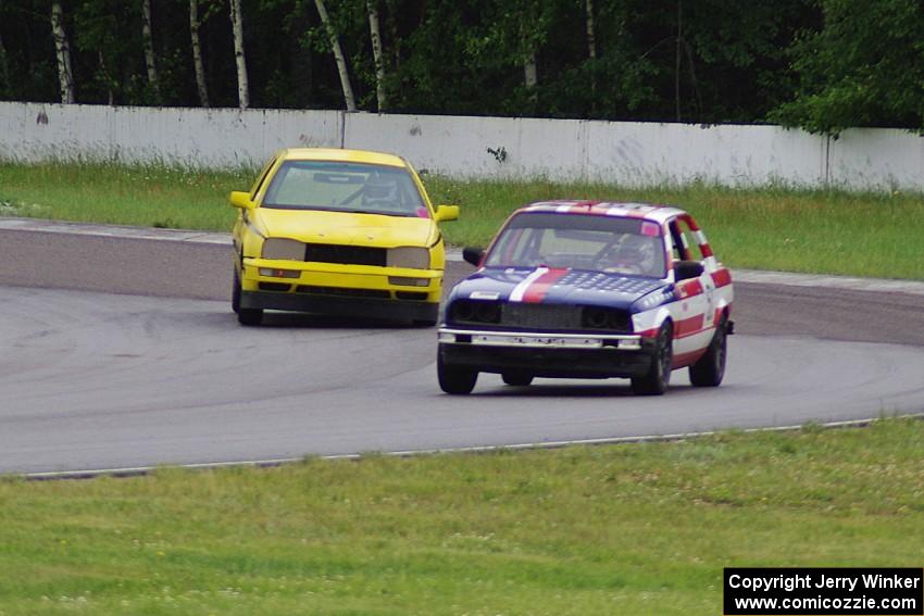 British American Racing BMW 318i and Team Short Bus VW Golf in the carousel.