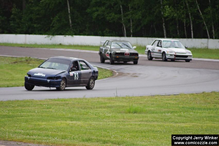 Mayhem Racing Honda Civic, E30 Bombers BMW 325i and Slugworks Honda Civic in the carousel.