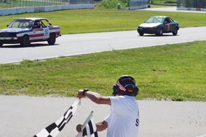 British American Racing BMW 318i and Three Sheets Ford Escort ZX2 take the checkered.