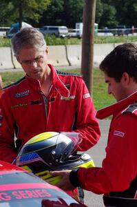 Pete Halsmer and Cameron Lawrence converse before qualifying