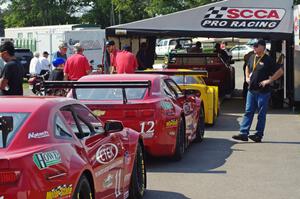 Tony Ave's Chevy Corvette, Pete Halsmer's Chevy Camaro and Cameron Lawrence's Chevy Camaro at post-qualifying inspection.