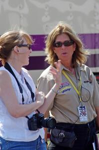 Trans-Am official Lisa Simoni chats with a photographer.