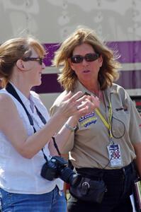 Trans-Am official Lisa Simoni chats with a photographer.