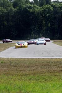 The field streams into turn four on the first lap.