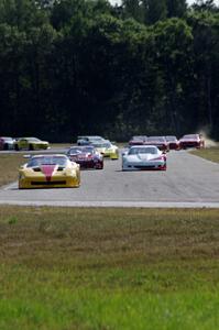 The field streams into turn four on the first lap.