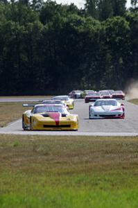 The field streams into turn four on the first lap.