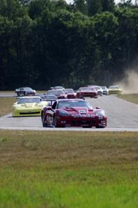 The field streams into turn four on the first lap.