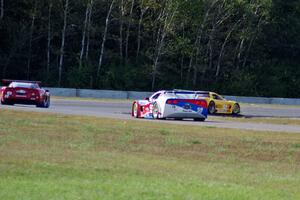 Tony Ave's Chevy Corvette leads Amy Ruman's Chevy Corvette and Simon Gregg's Chevy Corvette