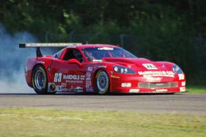 Amy Ruman's Chevy Corvette locks up the brakes coming into turn three.