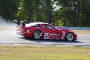 Amy Ruman's Chevy Corvette locks up the brakes at turn three.