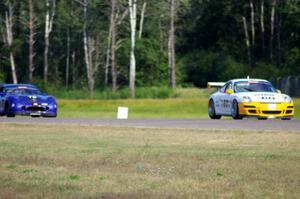Tim Gray's Porsche GT3 Cup and Chuck Cassaro's Panoz GTS battle in GGS.
