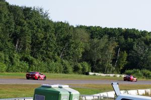 Bob Stretch's Chevy Camaro and Pete Halsmer's Chevy Camaro battle for the lead in TA2