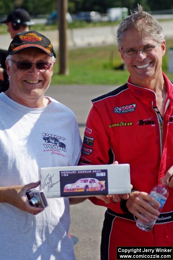 Pete Halsmer signs a model box for a fan.