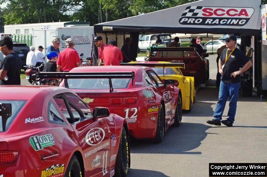 Tony Ave's Chevy Corvette, Pete Halsmer's Chevy Camaro and Cameron Lawrence's Chevy Camaro at post-qualifying inspection.