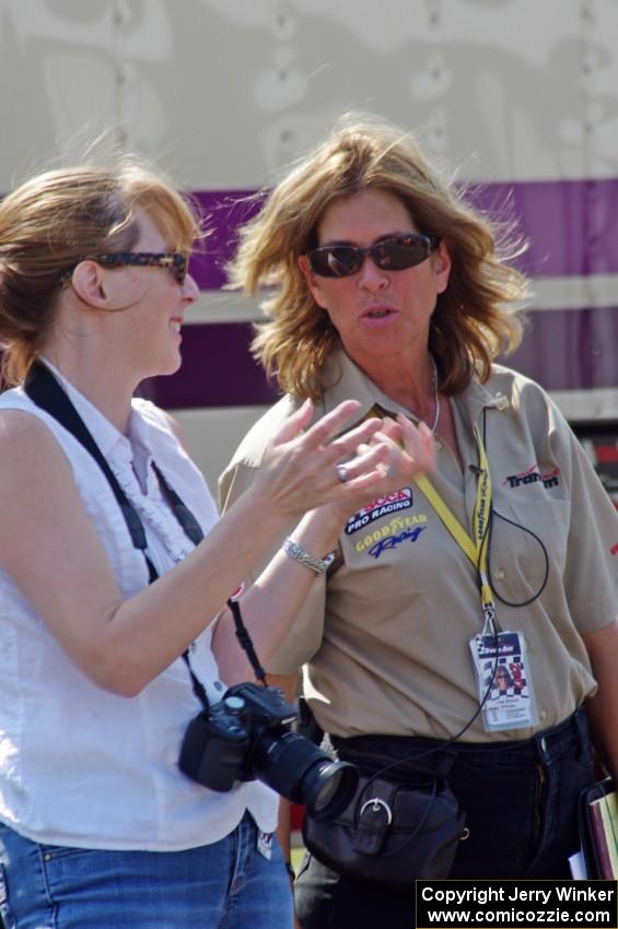 Trans-Am official Lisa Simoni chats with a photographer.