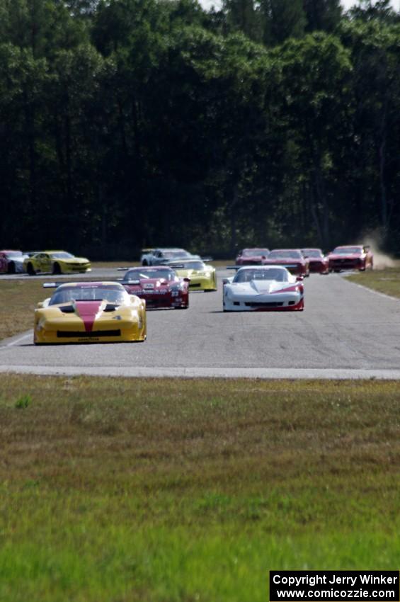 The field streams into turn four on the first lap.