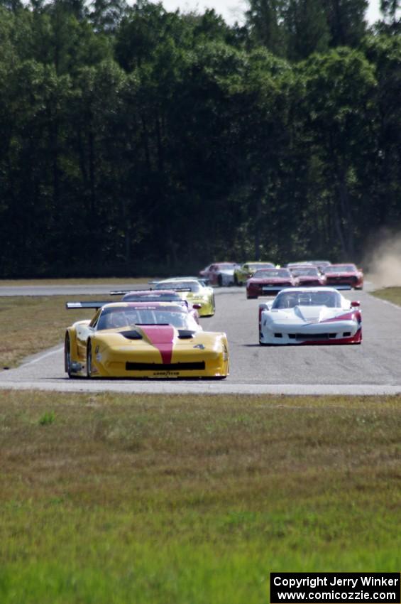 The field streams into turn four on the first lap.