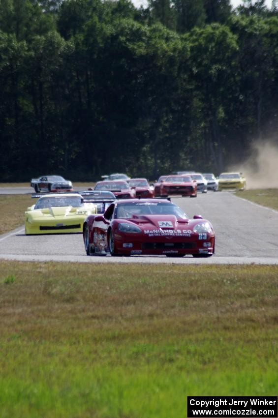 The field streams into turn four on the first lap.