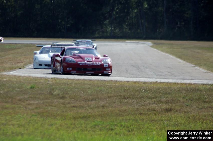 Second through fifth place come into turn four on lap two.