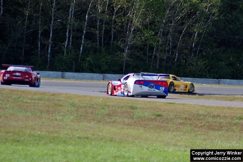 Tony Ave's Chevy Corvette leads Amy Ruman's Chevy Corvette and Simon Gregg's Chevy Corvette