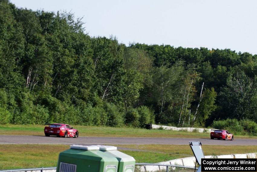 Bob Stretch's Chevy Camaro and Pete Halsmer's Chevy Camaro battle for the lead in TA2