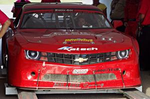 Cameron Lawrence's Chevy Camaro is weighed after the race on Saturday.