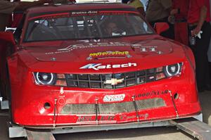 Cameron Lawrence's Chevy Camaro is weighed after the race on Saturday.