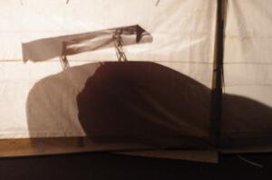 One of the Fix Rim Team Chevy Camaros casts a shadow on the tent.