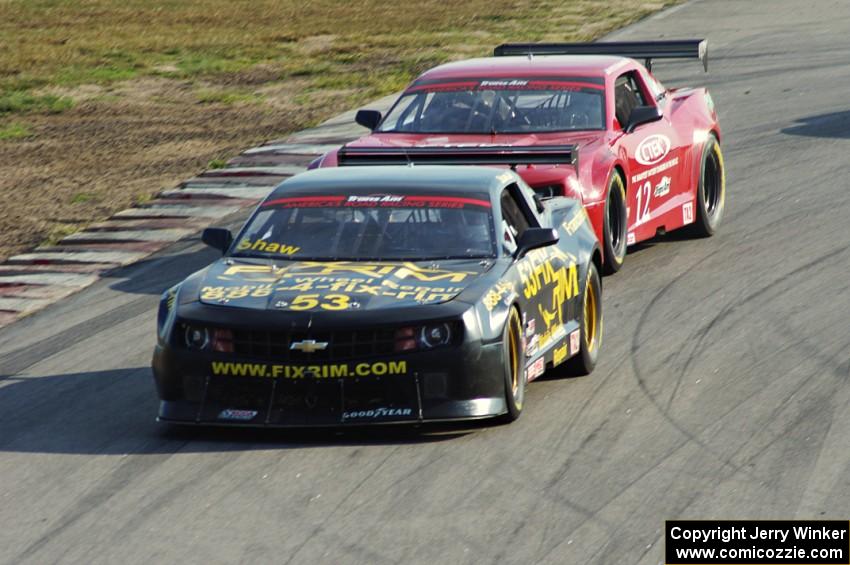 Mel Shaw's Chevy Camaro about to be lapped by Pete Halsmer's Chevy Camaro