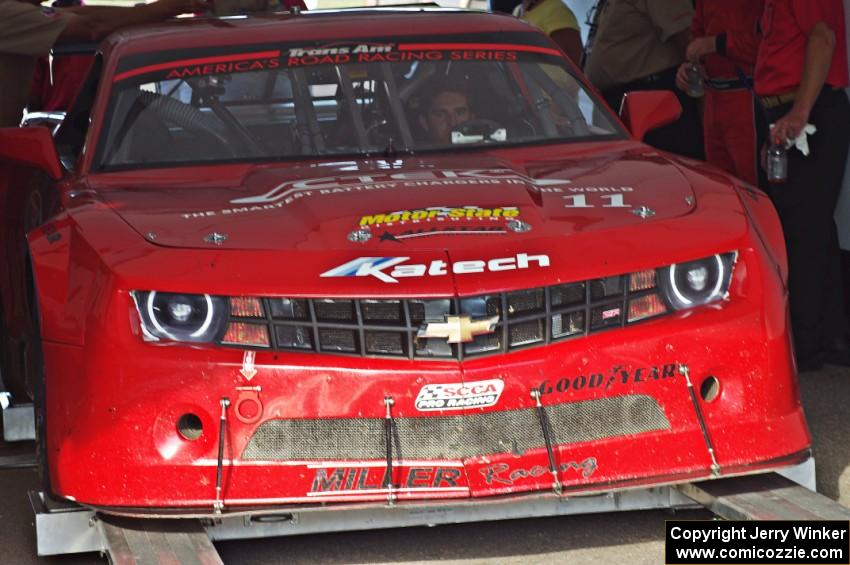 Cameron Lawrence's Chevy Camaro is weighed after the race on Saturday.