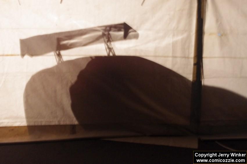 One of the Fix Rim Team Chevy Camaros casts a shadow on the tent.